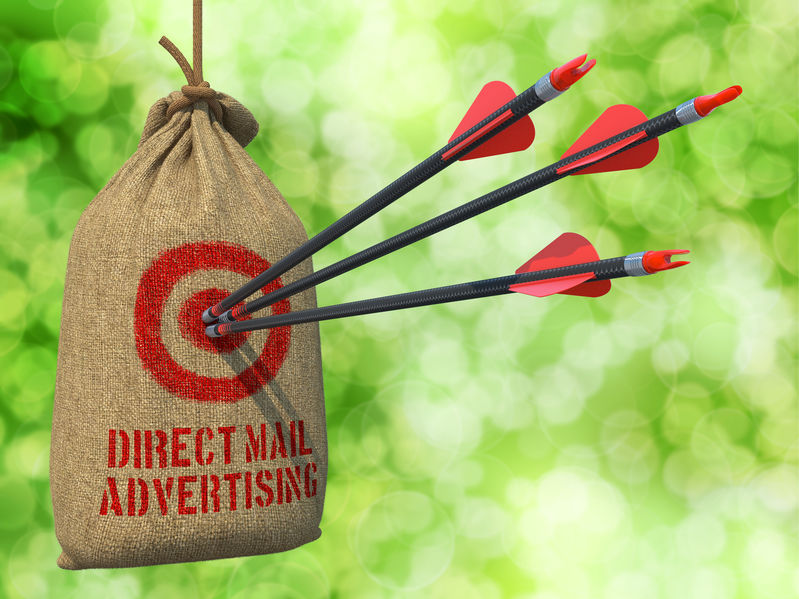 Direct Mail Advertising - Arrows Hit in Red Target.