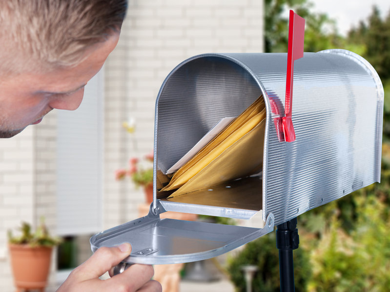 Man Opening The Mailbox